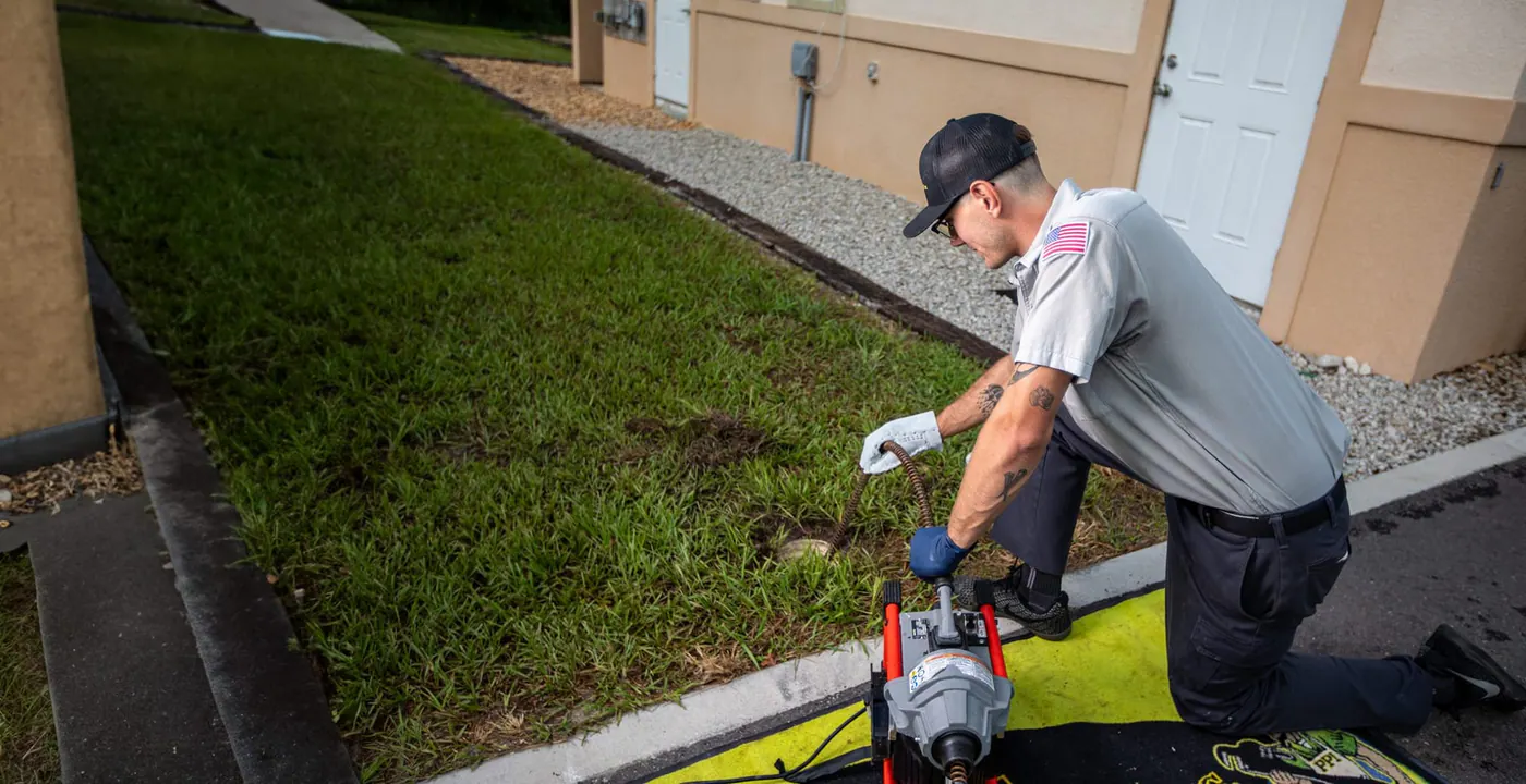 Plumbing technician at work on a home system